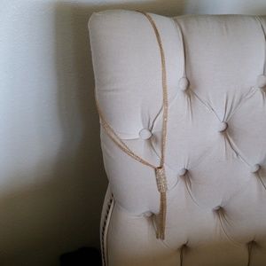 Gold colored necklace with rhinestones